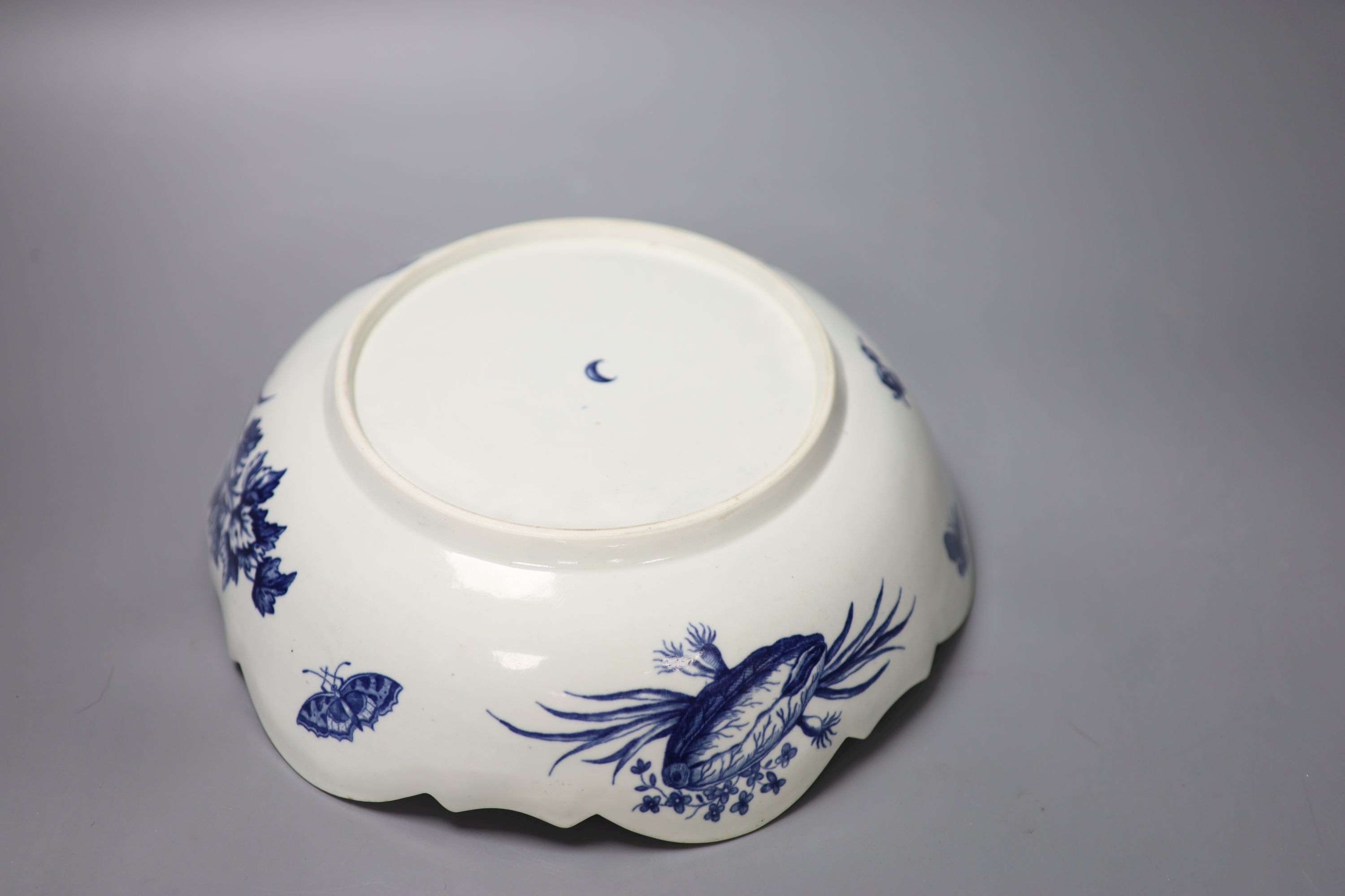 A Worcester salad bowl printed on the inside in underglaze blue with flowers, pomegranate and fir cones,